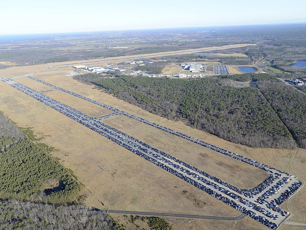 15,000 flood-damaged cars from Hurricane Sandy on airport runway